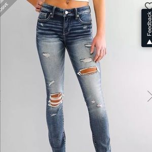 Buckle Black Jeans skinny form fitting. Superior Stretch. These jeans look great